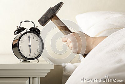 http://thumbs.dreamstime.com/x/smashing-alarm-clock-hammer-17952022.jpg
