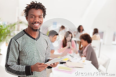 Smiling African College Student With a Tablet