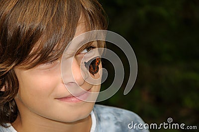 Smiling boy with butterfly