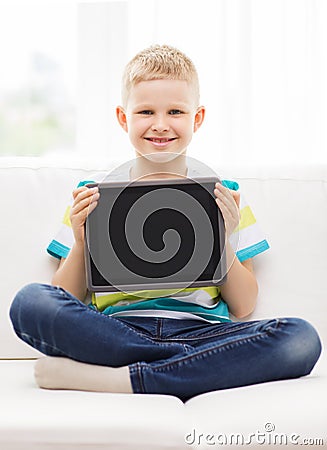 Smiling boy with tablet pc computer at home