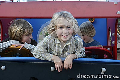 Smiling Boys in Toy Truck