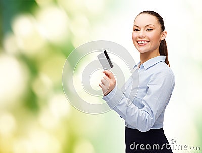 Smiling businesswoman showing credit card