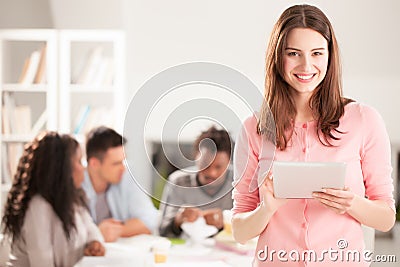 Smiling College Student With a Tablet