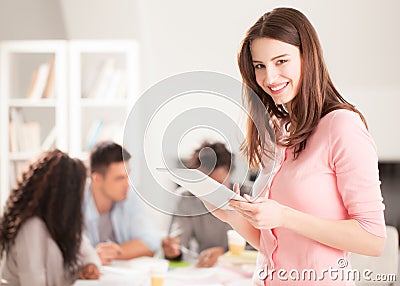 Smiling College Student With a Tablet