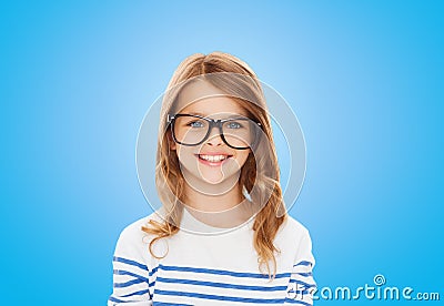 Smiling cute little girl with black eyeglasses