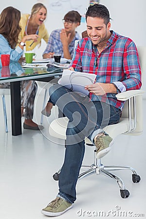 Smiling designer working in his office