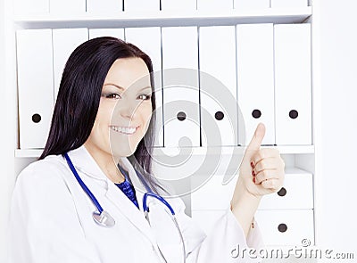 Smiling doctor woman with stethoscope in office