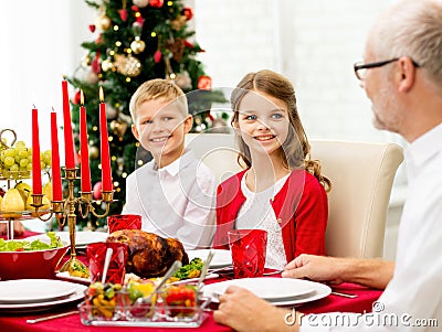 Smiling family having holiday dinner at home