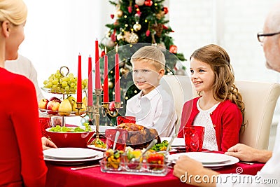 Smiling family having holiday dinner at home