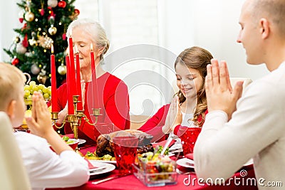 Smiling family having holiday dinner at home