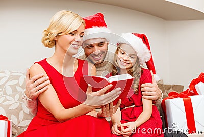 Smiling family reading book