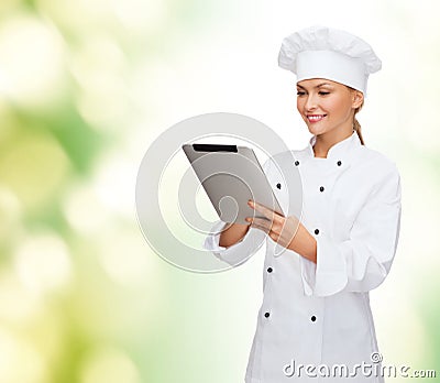 Smiling female chef with tablet pc computer