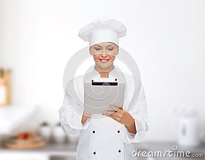 Smiling female chef with tablet pc computer