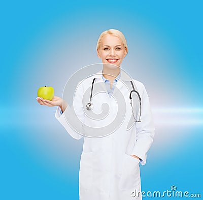 Smiling female doctor with green apple