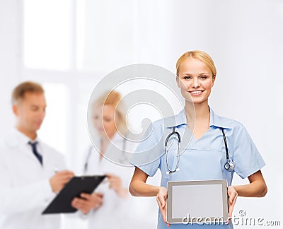 Smiling female doctor or nurse with tablet pc