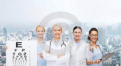 Smiling female eye doctors and nurses