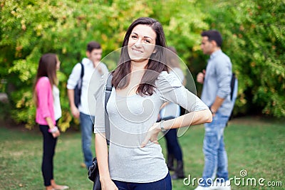 Smiling female student at the park
