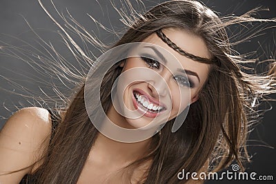 Smiling girl with blowing hair