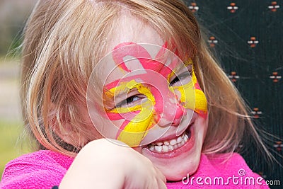 Smiling girl with face paint