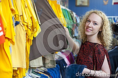 Smiling girl in thrift store 2