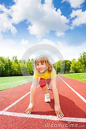 Smiling girl in uniform ready to run marathon