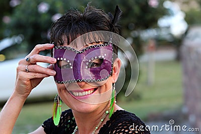 Smiling healthy beautiful mother with mask