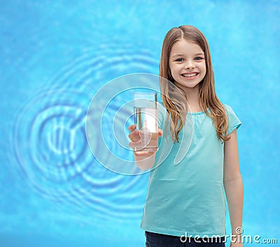 Smiling little girl giving glass of water