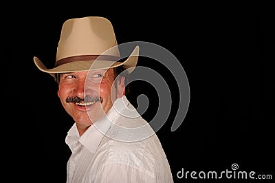 Smiling man in cowboy hat