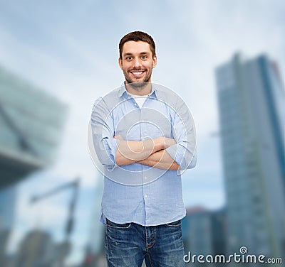 Smiling man with crossed arms
