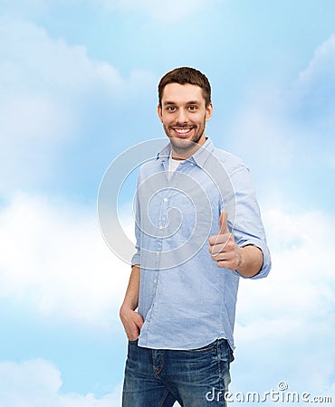 Smiling man showing thumbs up