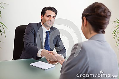 Smiling manager interviewing a female applicant