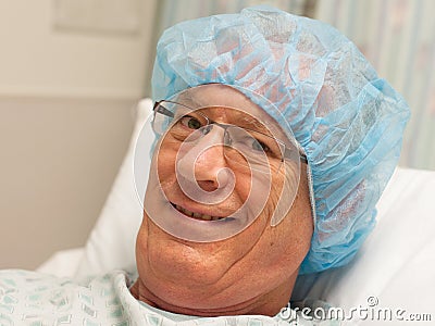 Smiling, mature caucasian man ready for surgery.