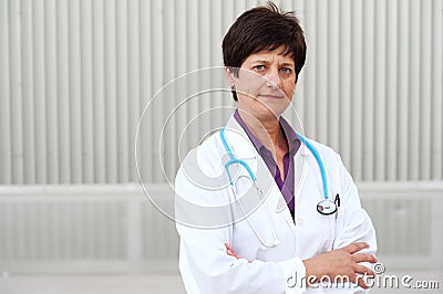 Smiling medical doctor woman with stethoscope.