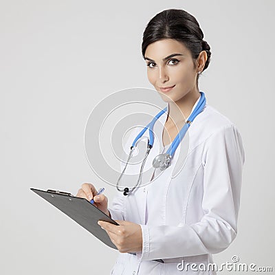 Smiling medical doctor woman with stethoscope.