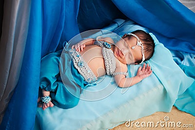 Smiling Newborn Baby Girl Wearing a Belly Dance Costume