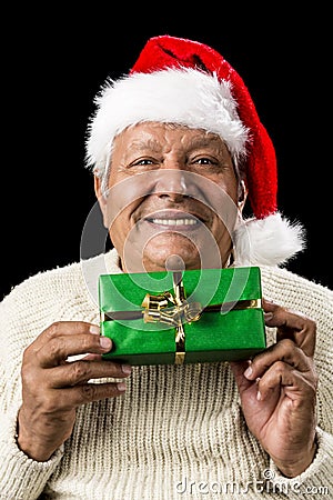 Smiling Old Man Handing Over A Wrapped Green Gift