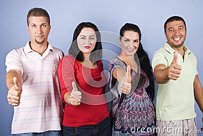 Smiling people giving thumbs up