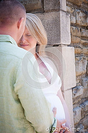 http://thumbs.dreamstime.com/x/smiling-pregnant-woman-husband-touching-belly-happy-young-women-his-wife-s-35881807.jpg