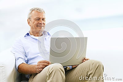 Smiling Senior Man On Couch