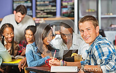 Smiling Student Doing Homework