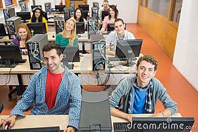 Smiling students in the college computer room