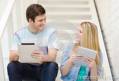 Smiling students with tablet pc computer