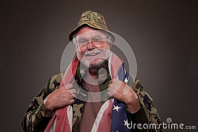 Smiling Vietnam Veteran with American flag