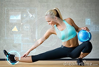 Smiling woman with exercise ball in gym