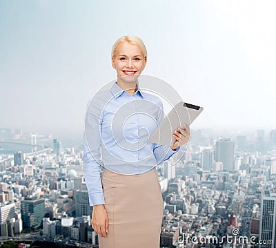 Smiling woman looking at tablet pc computer