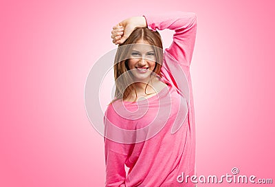 Smiling woman portrait against pink background