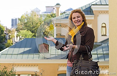 Smiling woman running the broker shows real estate
