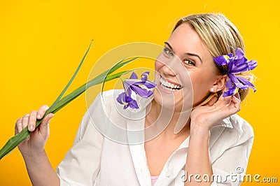 Smiling woman with spring flower in hair