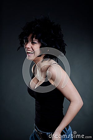 Smiling woman wearing a black wig