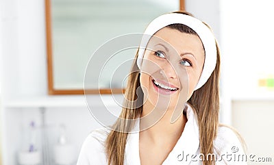 Smiling woman wearing headband in the bathroom